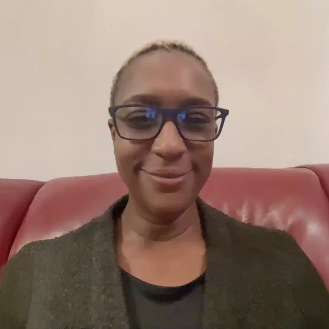 a woman sitting on a red couch