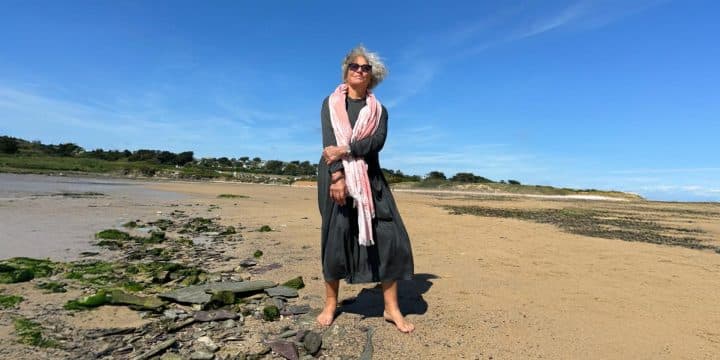 Geraldine Waring on a beach
