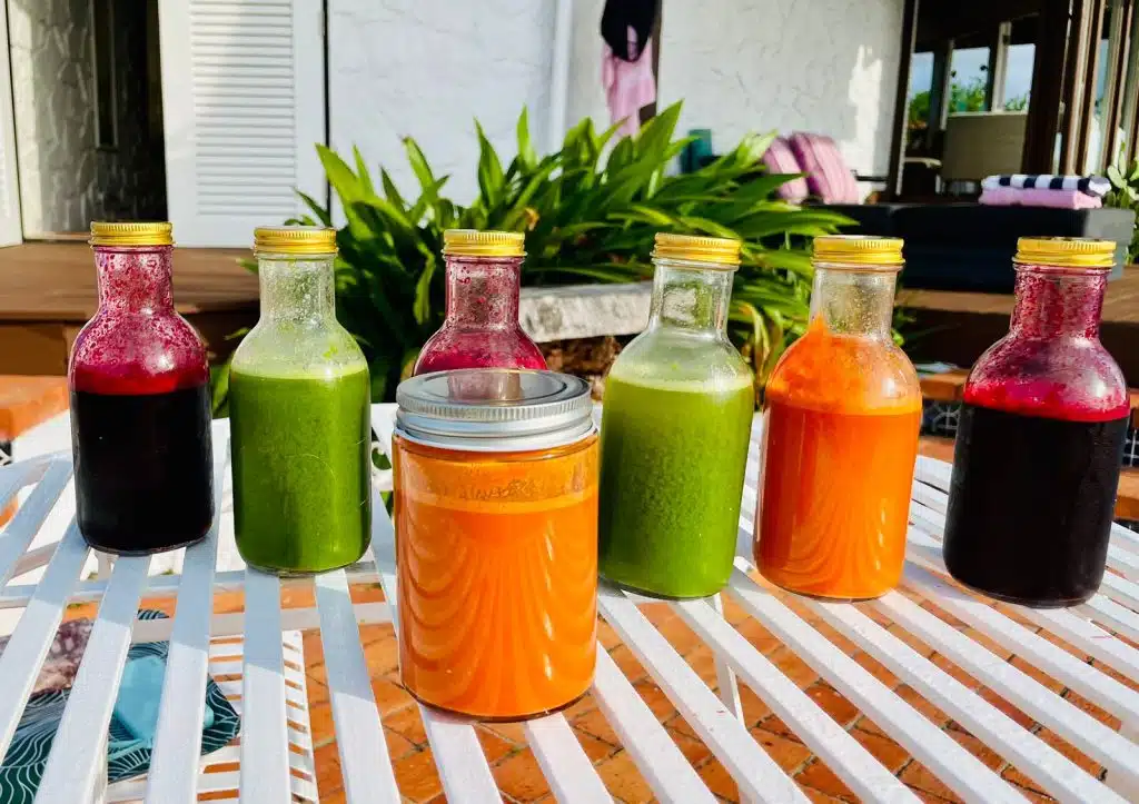 a group of bottles of juice on a table